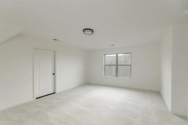 a view of a hallway view with wooden floor and staircase