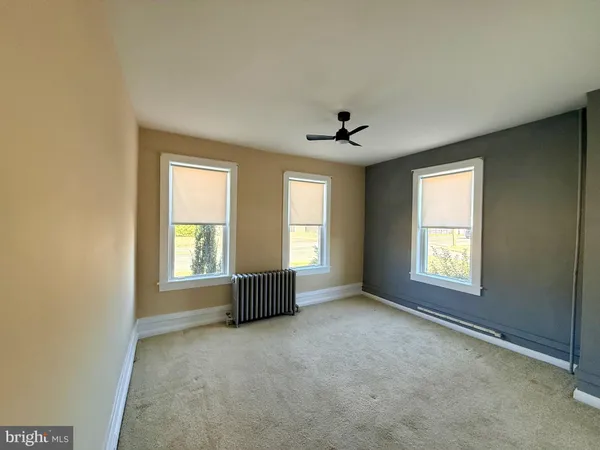 a view of empty room with windows