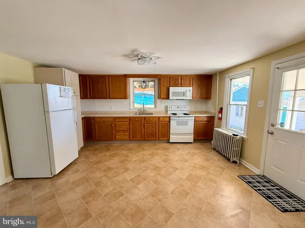 a kitchen with stainless steel appliances a refrigerator and a stove
