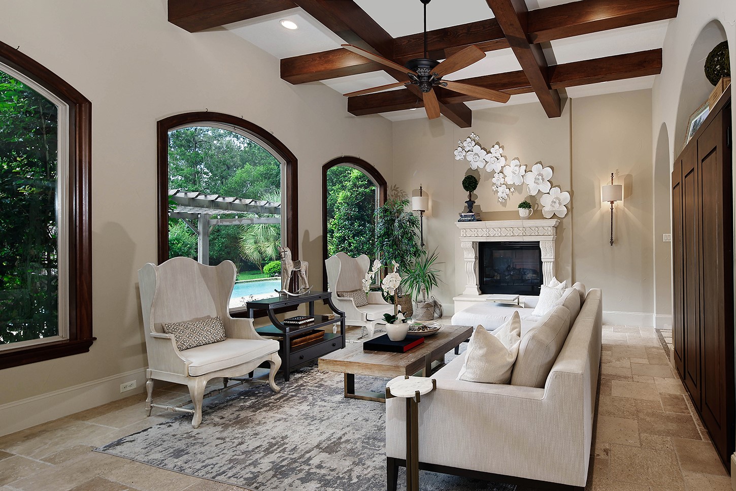 119 Angel Leaf Road The Woodlands, TX 77380 - Photo 11 of 50 a living room with furniture fireplace and a floor to ceiling window