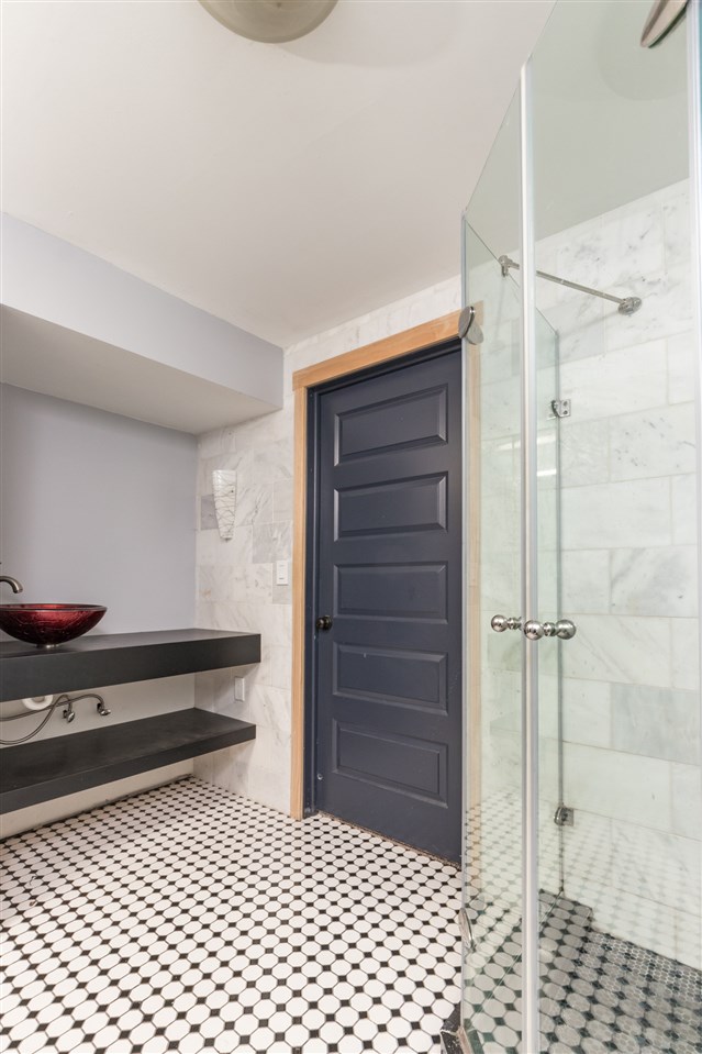 6526 North Marrill Road Byron, IL 61010 - Photo 23 of 25 a bathroom with a sink a mirror and shower