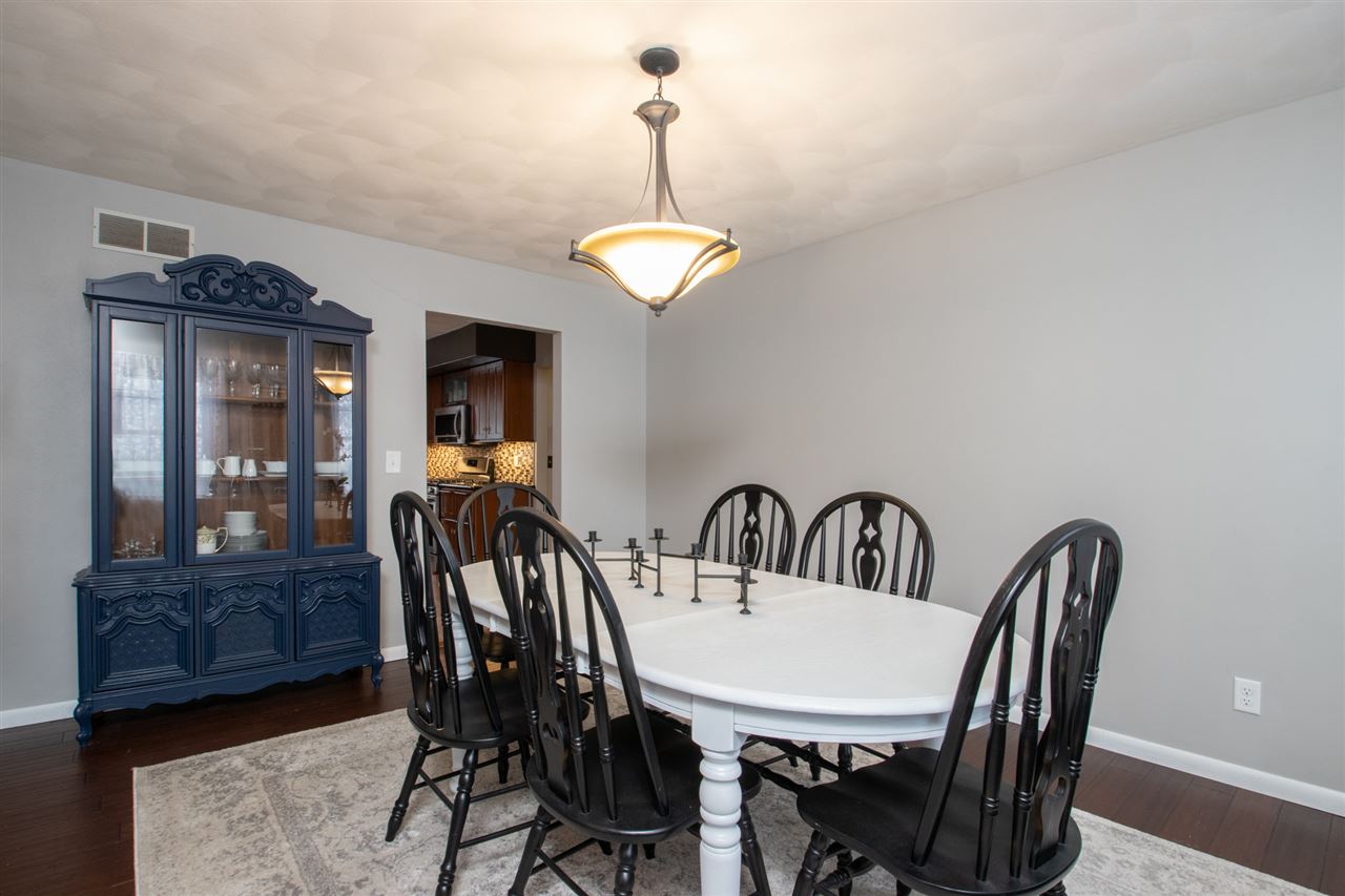 6526 North Marrill Road Byron, IL 61010 - Photo 7 of 25 a view of a dining room with furniture and chandelier