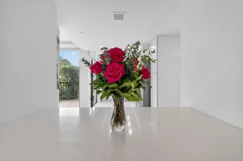 a spacious bathroom with a granite countertop sink mirror and toilet