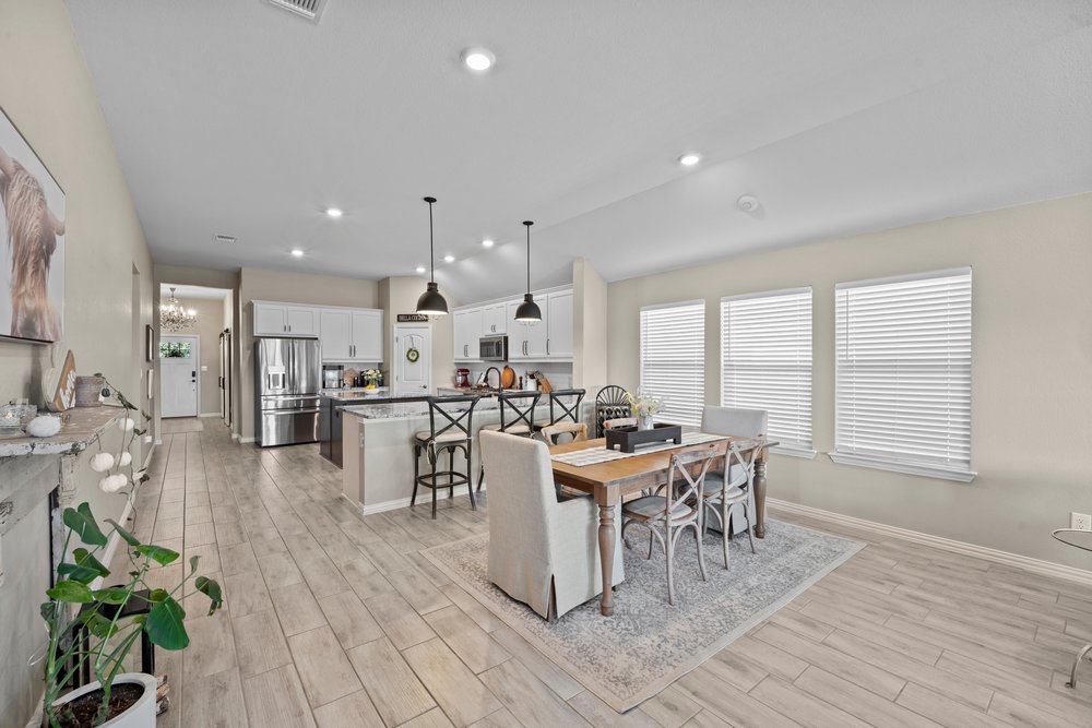 529 Cold Riv Run Kyle, TX 78640 - Photo 11 of 39 An open, spacious dining room creates a welcoming atmosphere, ideal for relaxed and cozy family dinners.