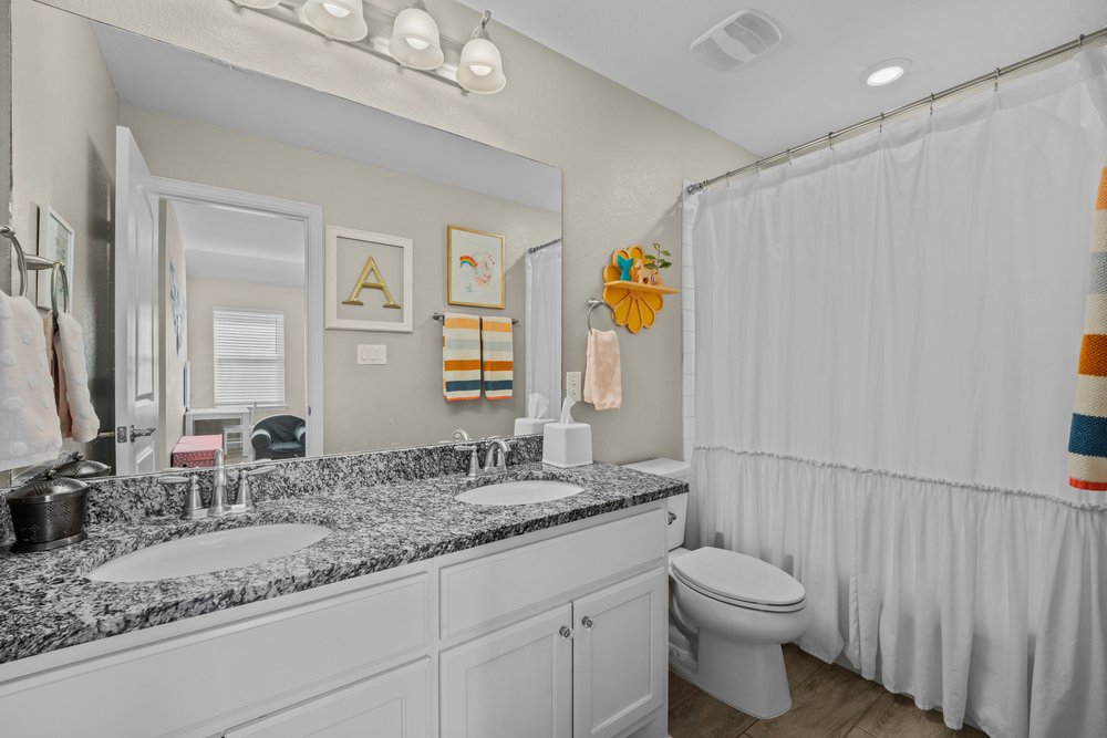 529 Cold Riv Run Kyle, TX 78640 - Photo 27 of 39 This beautiful full bath is attached to the family room (kids living area) making it quite convenient for the little ones and or guests. You will notice that you have the same granite countertops that are in the other areas of the home. The dual vanity will definitely allow a more civil living situation amongst siblings. Little details like this goes a long way for a parent's sanity!