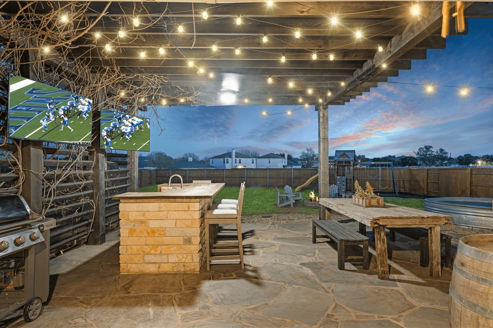 529 Cold Riv Run Kyle, TX 78640 - Photo 33 of 39 Enjoy the big game with friends and family at your own personal outdoor sports bar!