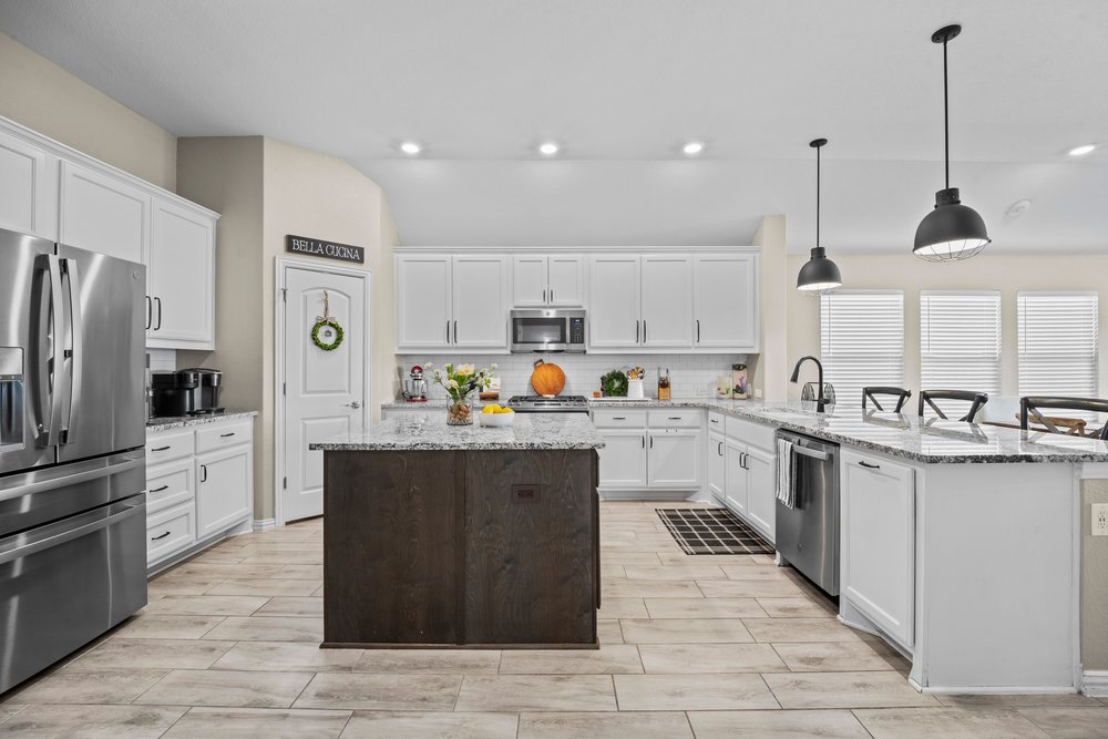 529 Cold Riv Run Kyle, TX 78640 - Photo 6 of 39 The kitchen has terrific flow with an abundant amount of storage and countertop space! It also has a 5-burner gas cooktop/oven. The center island comes equipped with additional cabinetry, drawers, and electric outlets for added convenience. These features are sure to be appreciated by any serious cooks out there!
