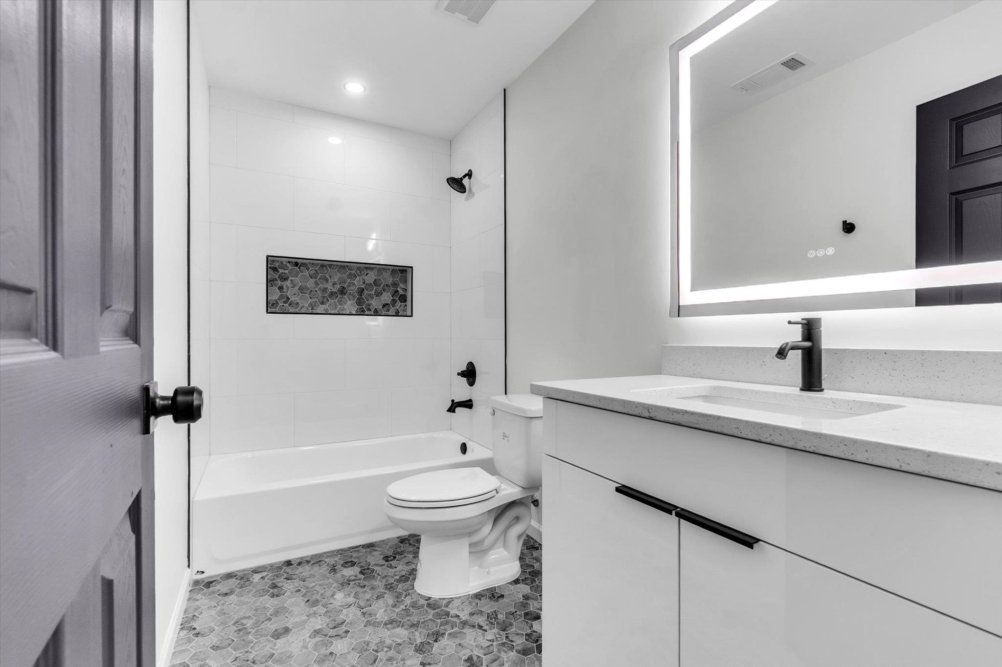 574 Lipford Street Memphis, TN 38112 - Photo 17 of 26 a bathroom with a sink toilet and shower