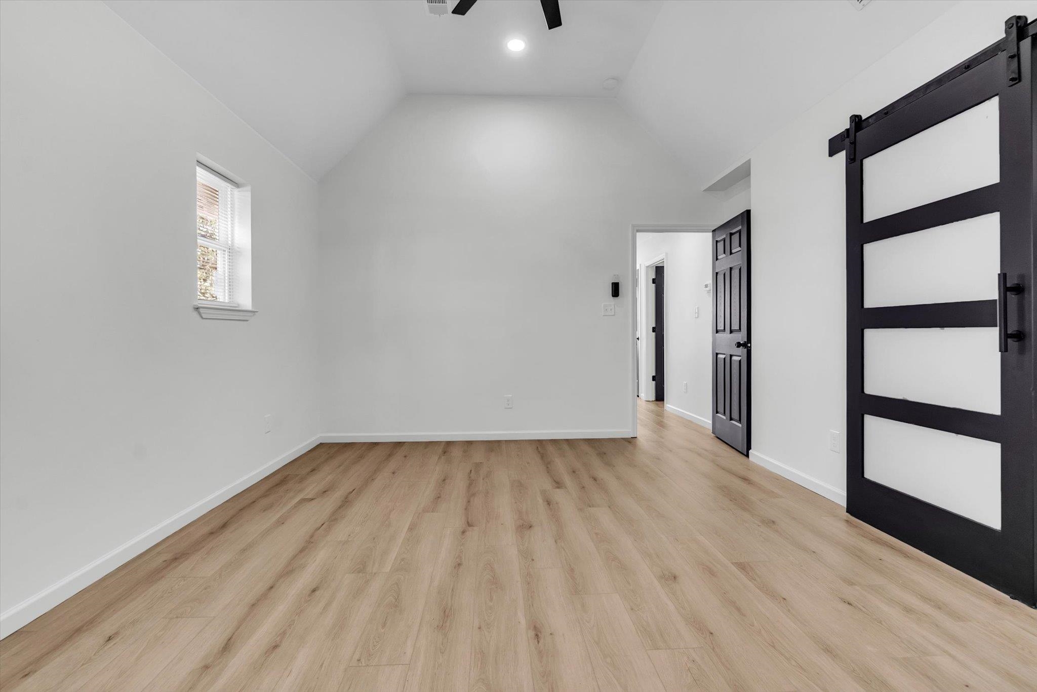 574 Lipford Street Memphis, TN 38112 - Photo 19 of 26 wooden floor in an empty room with a window