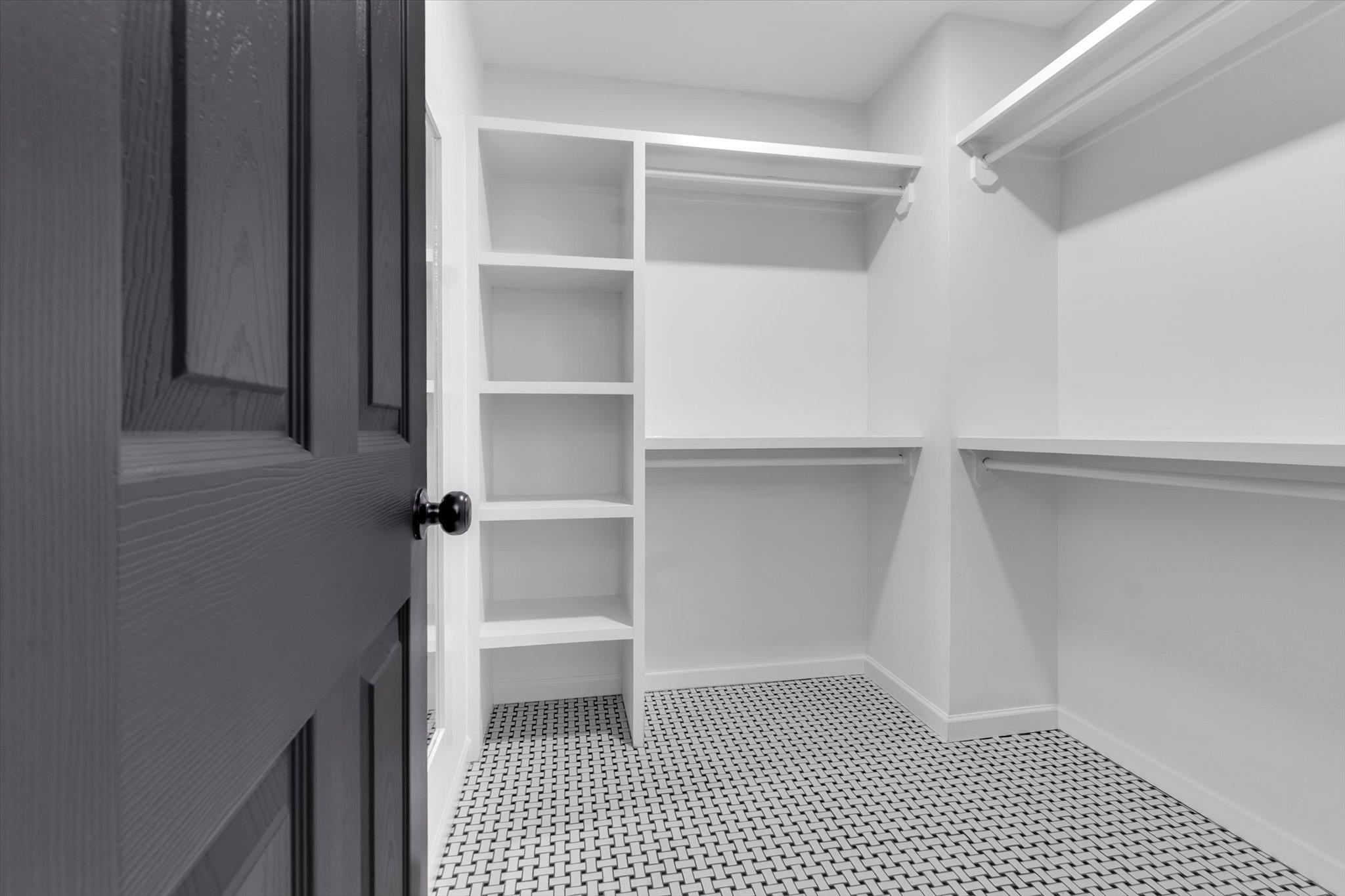 574 Lipford Street Memphis, TN 38112 - Photo 23 of 26 a view of walk in closet with empty racks