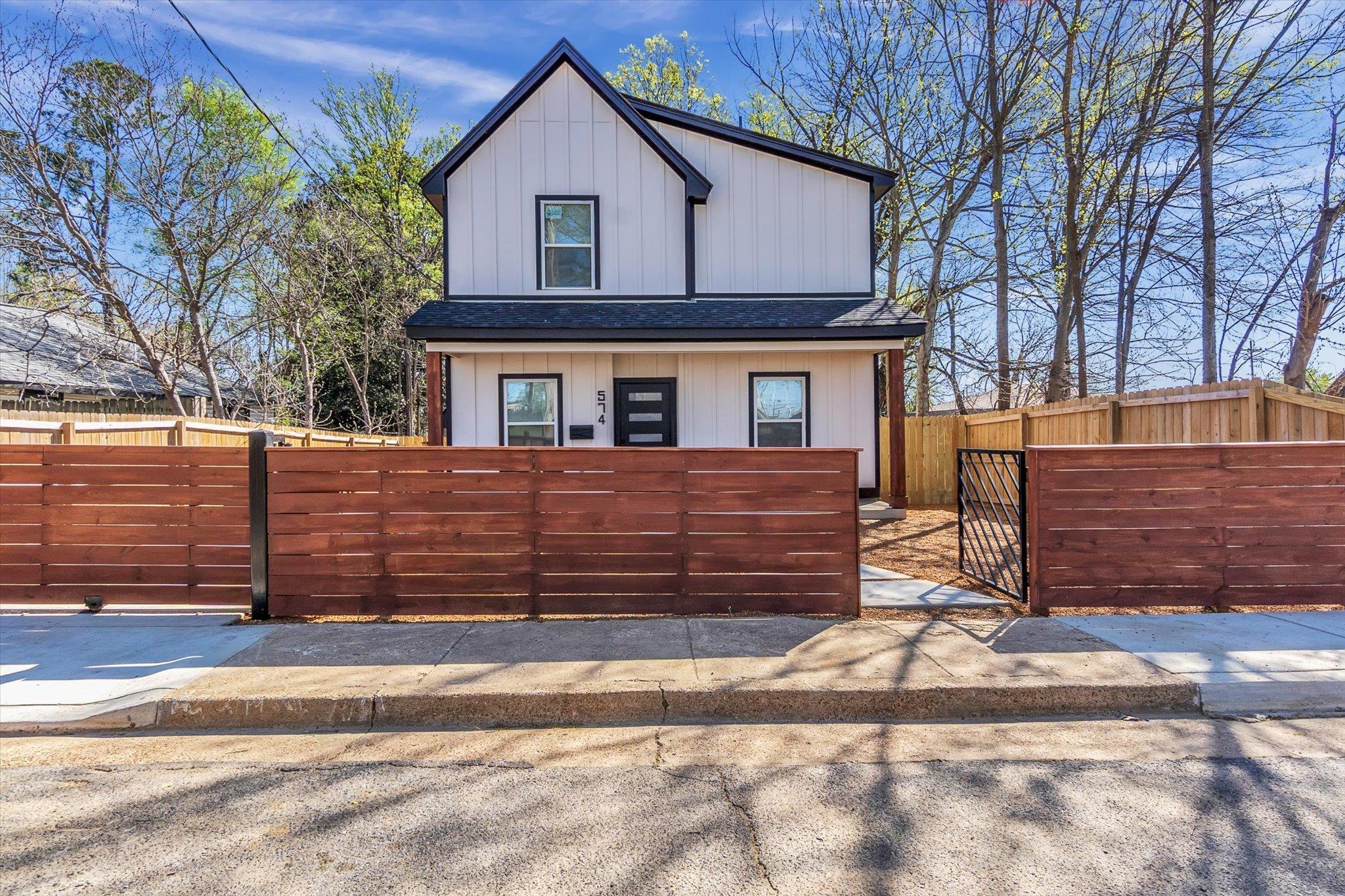 574 Lipford Street Memphis, TN 38112 - Photo 3 of 26 a front view of a house with a yard