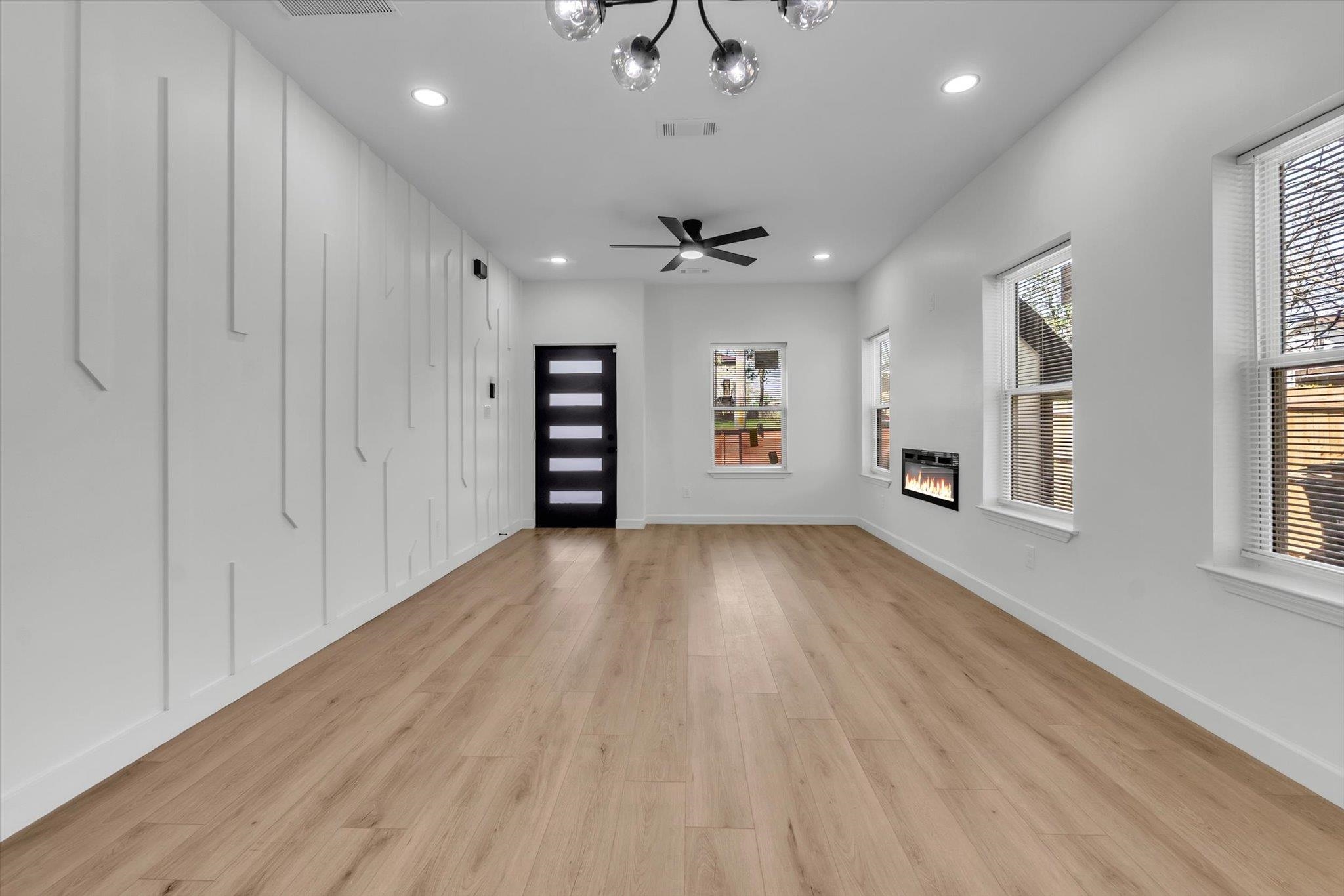 574 Lipford Street Memphis, TN 38112 - Photo 5 of 26 wooden floor in an empty room with a window