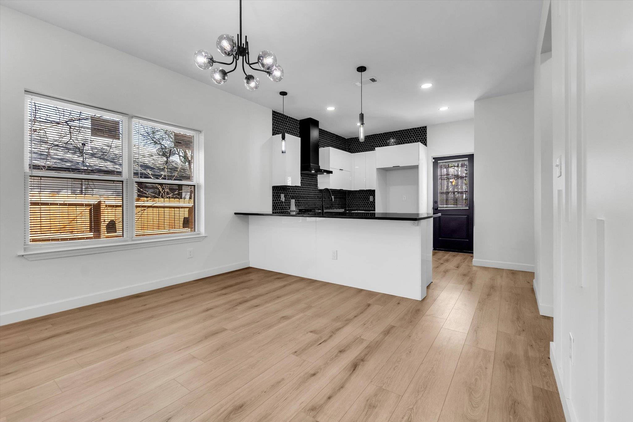 574 Lipford Street Memphis, TN 38112 - Photo 6 of 26 a view of a kitchen with a sink cabinets and wooden floor