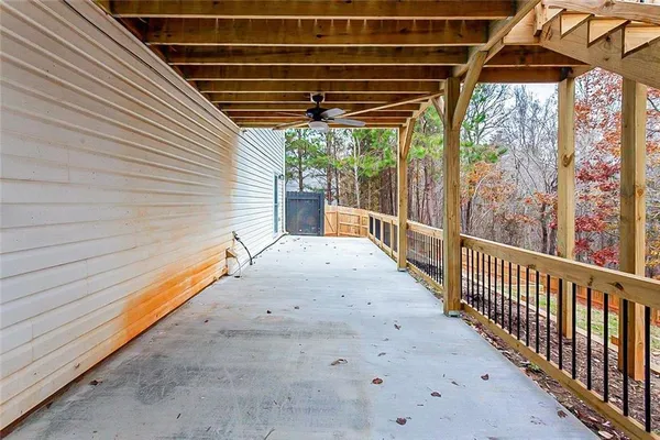 a view of a porch with wooden floor