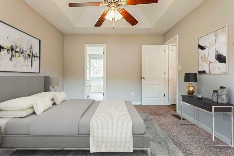 427 Southridge Road Winder, GA 30680 - Photo 3 of 31 a bedroom with a bed and painting on the wall