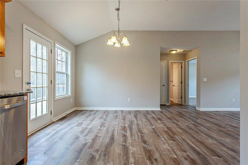 427 Southridge Road Winder, GA 30680 - Photo 8 of 31 a view of empty room with wooden floor and fan
