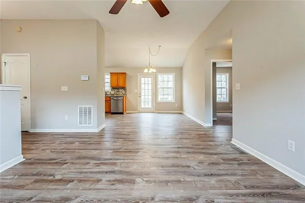 a view of a room window and wooden floor