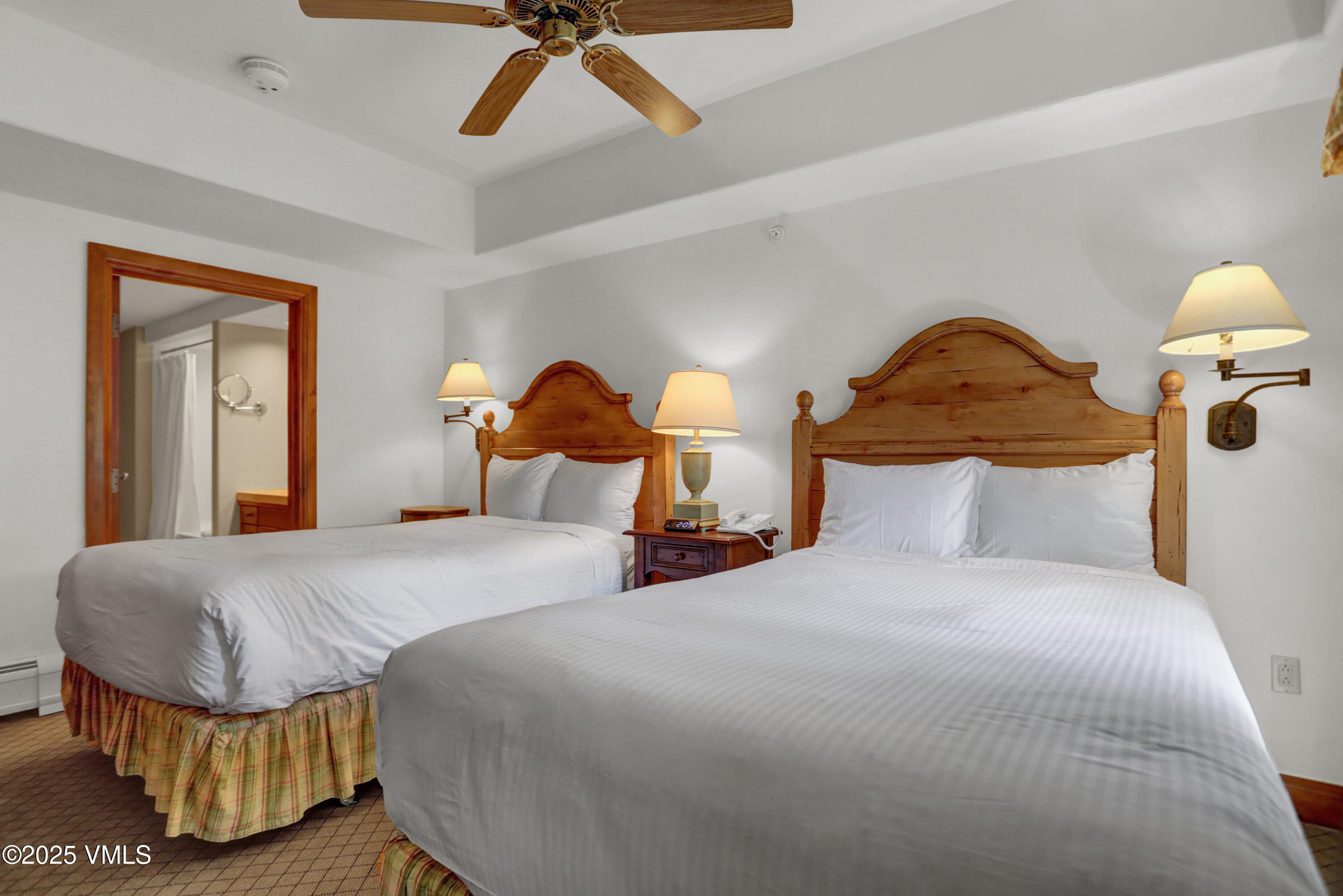 242 East Meadow Drive, Unit 3035 Vail, CO 81657 - Photo 19 of 28 a bedroom with a bed and flowerpot