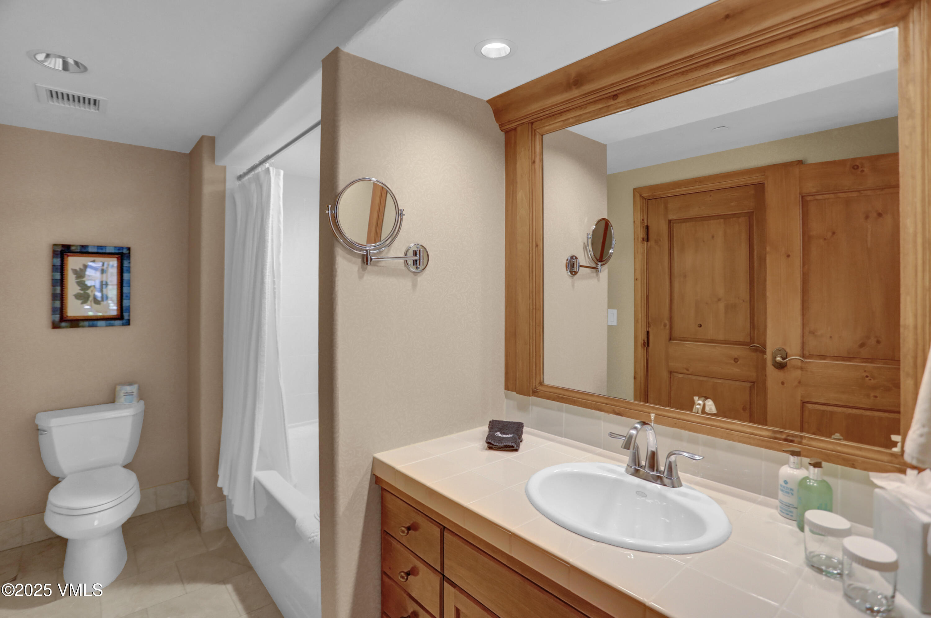 242 East Meadow Drive, Unit 3035 Vail, CO 81657 - Photo 21 of 28 a bathroom with a sink toilet and shower