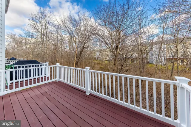 a view of deck with wooden floor and fence