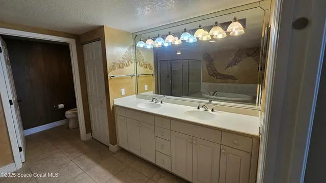 a bathroom with a sink double vanity and a mirror