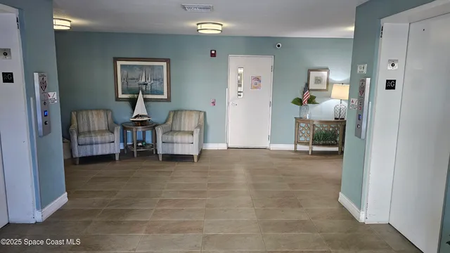 a view of a livingroom with furniture and a livingroom with furniture