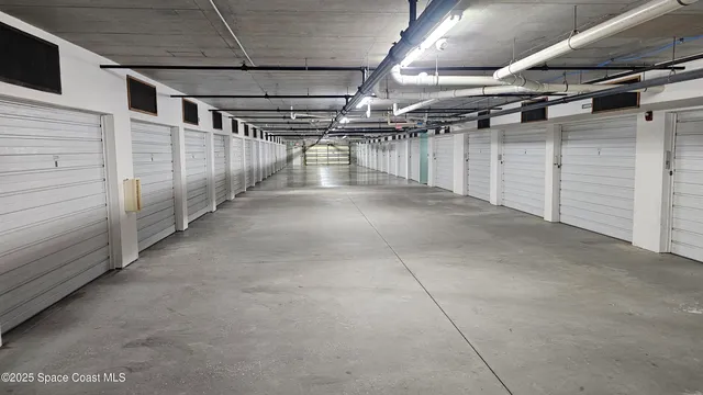 a view of a swimming pool with chairs in patio