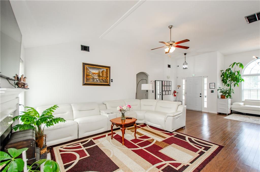 722 Moonlite Trace Winder, GA 30680 - Photo 11 of 41 a living room with furniture and a chandelier
