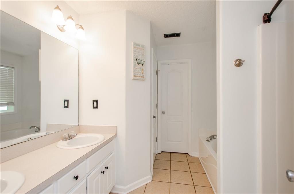 722 Moonlite Trace Winder, GA 30680 - Photo 20 of 41 a bathroom with a sink and a mirror
