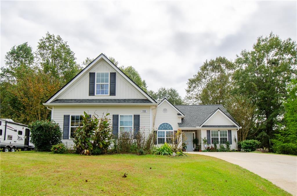 722 Moonlite Trace Winder, GA 30680 - Photo 2 of 41 a front view of a house with a yard