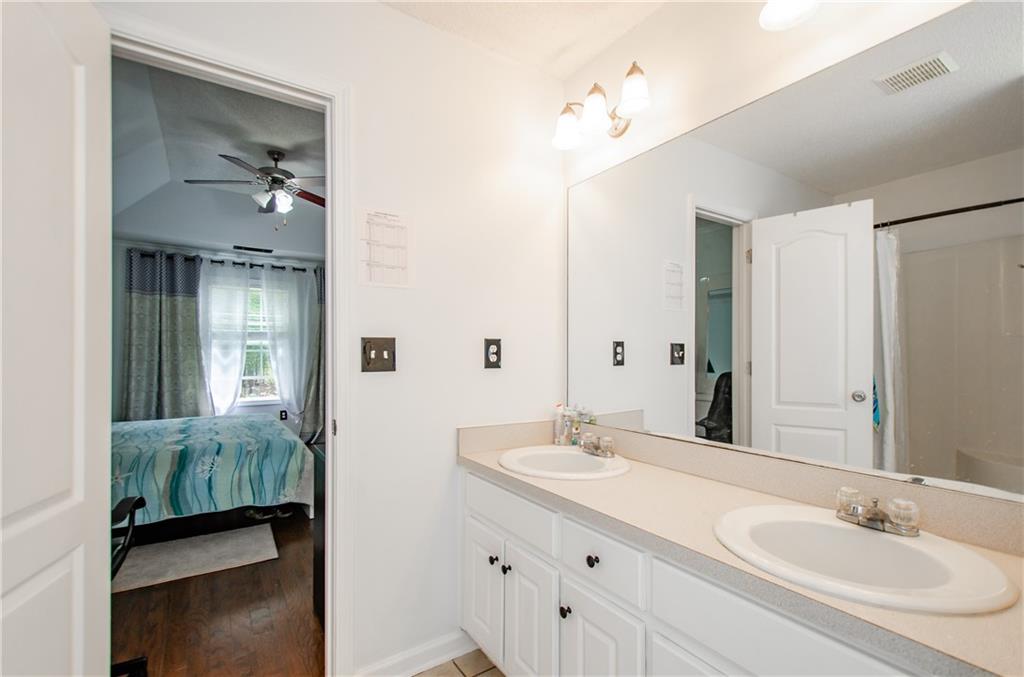 722 Moonlite Trace Winder, GA 30680 - Photo 21 of 41 a en suite bathroom with a sink double vanity and shower