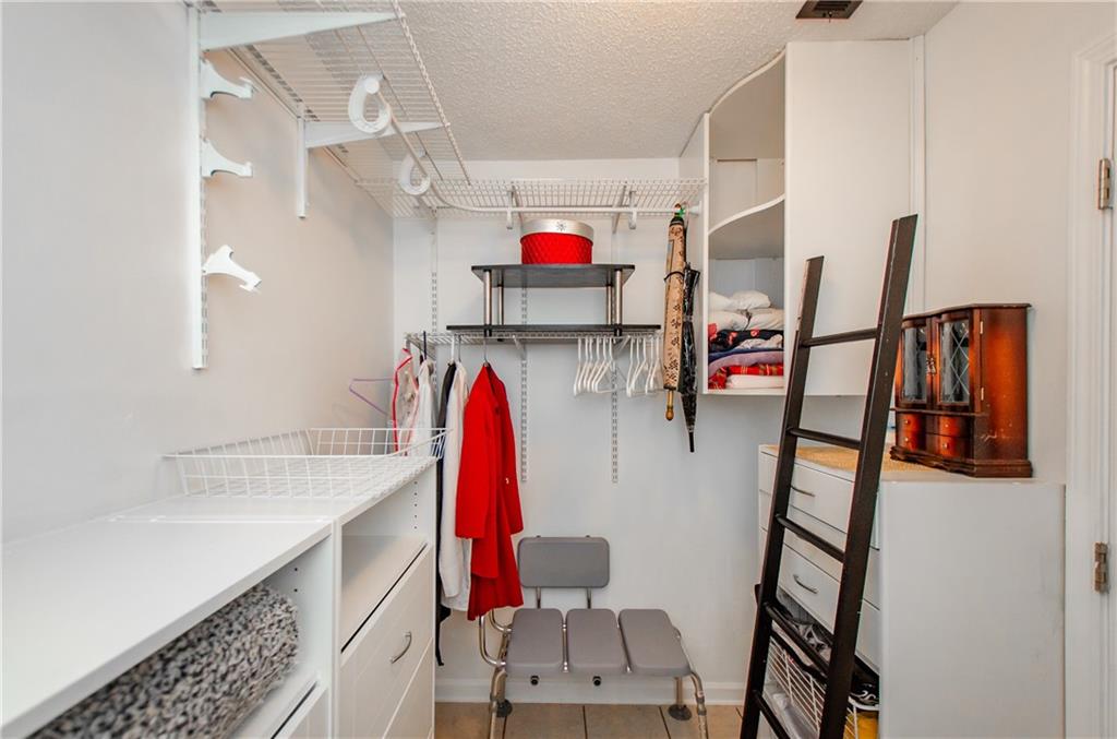 722 Moonlite Trace Winder, GA 30680 - Photo 23 of 41 a view of walk in closet with clothes and shoes
