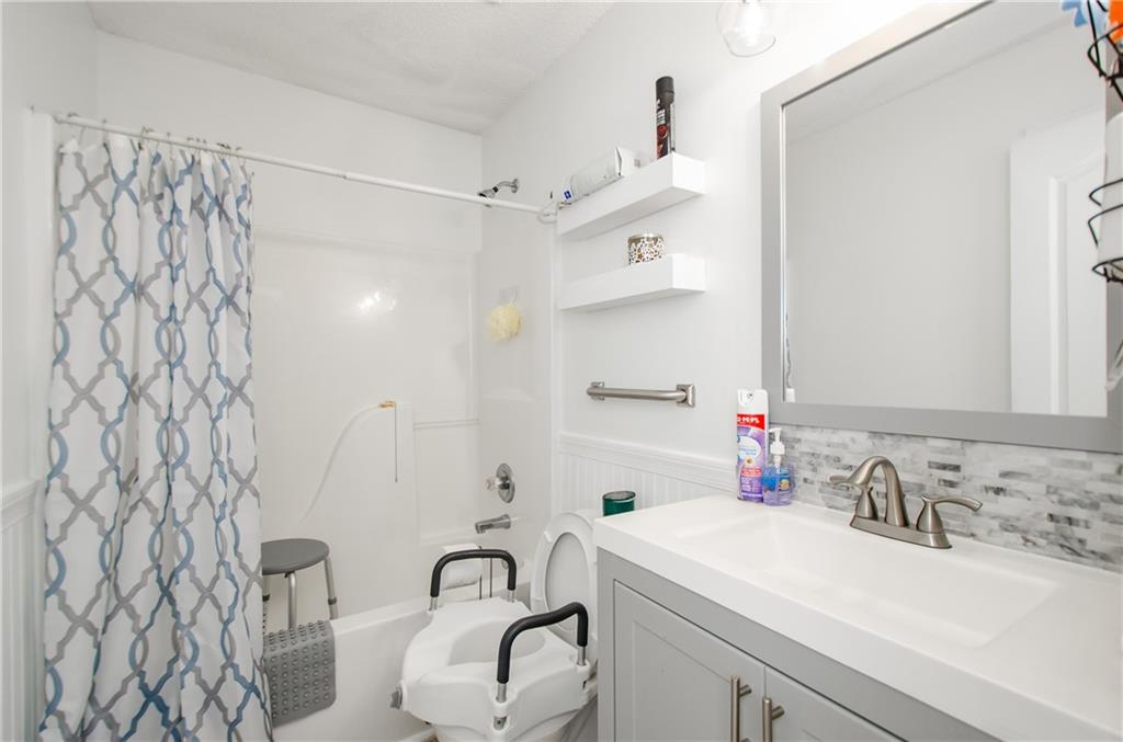 722 Moonlite Trace Winder, GA 30680 - Photo 26 of 41 a bathroom with a sink and a mirror