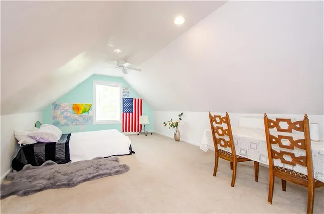 a bedroom with a bed and cabinets