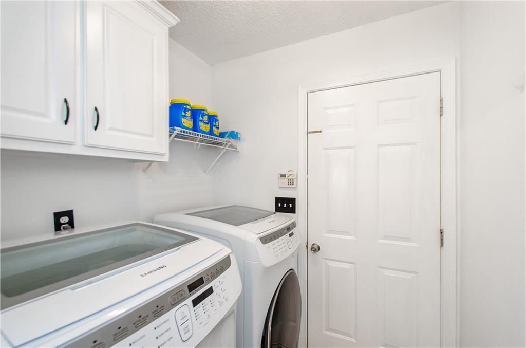 722 Moonlite Trace Winder, GA 30680 - Photo 29 of 41 a utility room with dryer and washer