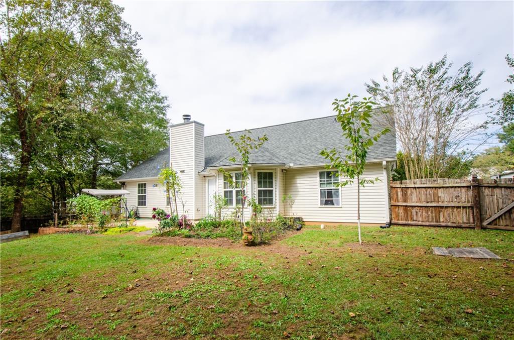 722 Moonlite Trace Winder, GA 30680 - Photo 34 of 41 a front view of house with yard and green space