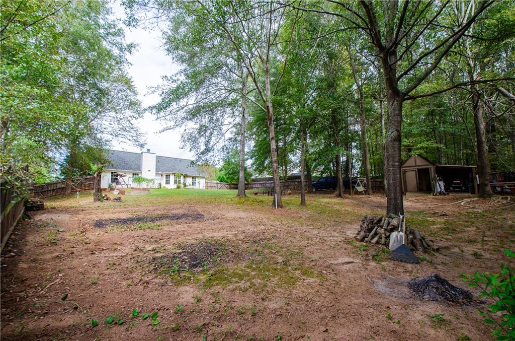 722 Moonlite Trace Winder, GA 30680 - Photo 36 of 41 a view of a tree in the middle of a yard