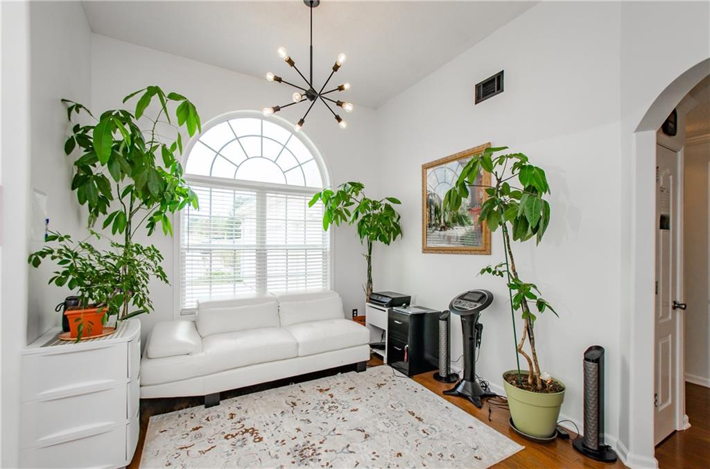 722 Moonlite Trace Winder, GA 30680 - Photo 7 of 41 a living room with furniture flowerpot and a chandelier