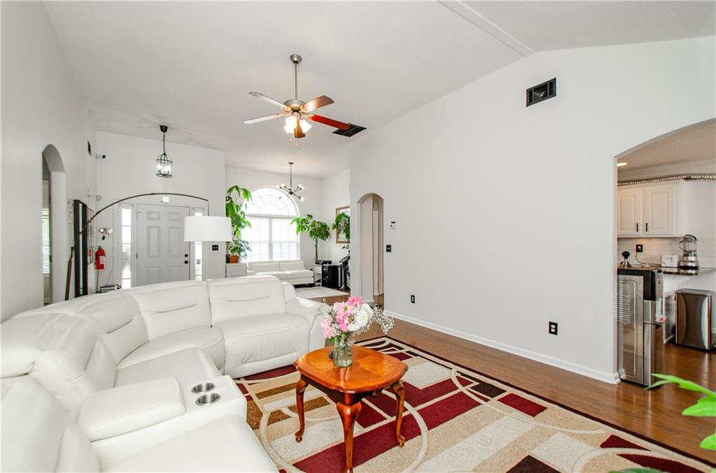 722 Moonlite Trace Winder, GA 30680 - Photo 10 of 41 a living room with furniture and wooden floor