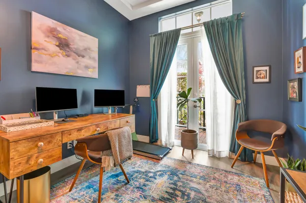 a workspace with furniture and window