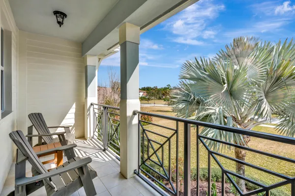 a view of balcony with furniture