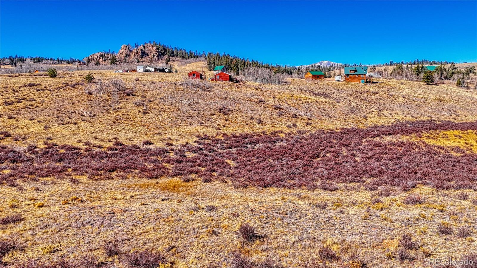 679 Apache Trail Como, CO 80456 - Photo 13 of 23 a view of a dry yard with wooden fence
