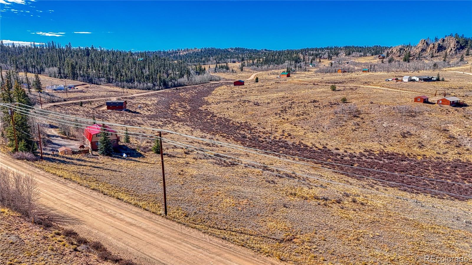 679 Apache Trail Como, CO 80456 - Photo 17 of 23 a view of a road with a yard