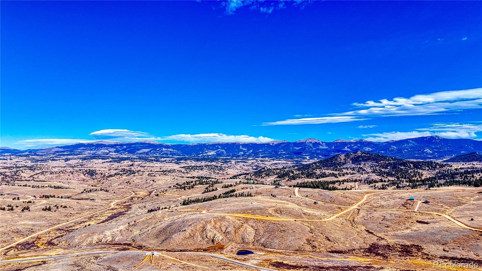 679 Apache Trail Como, CO 80456 - Photo 23 of 23 a view of a lake with mountains in the background