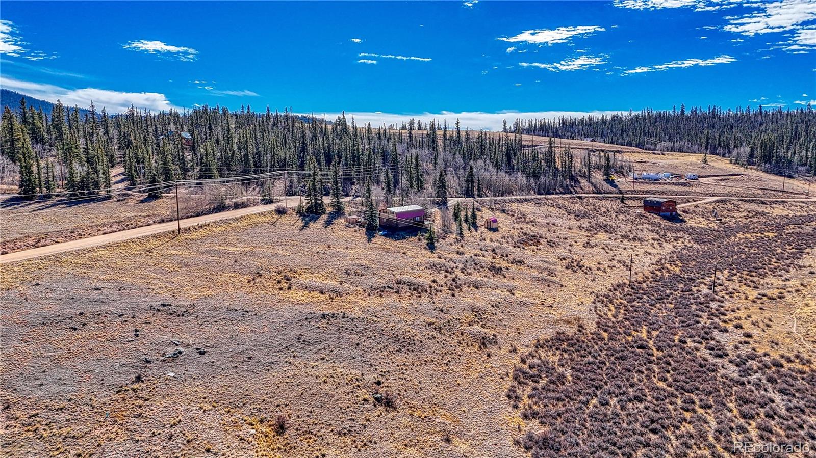 679 Apache Trail Como, CO 80456 - Photo 7 of 23 a view of a terrace with a bench