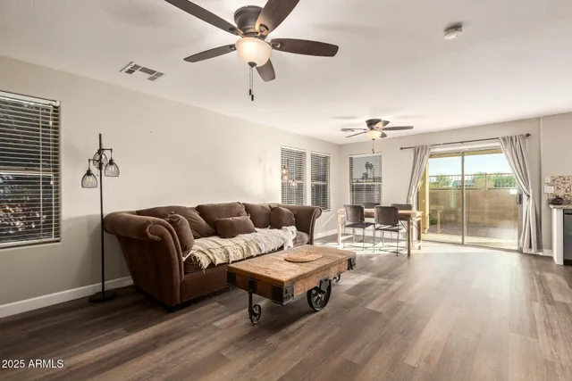 a living room with furniture and a large window