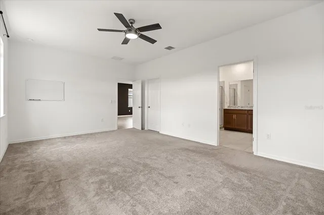 a view of a big room with carpet