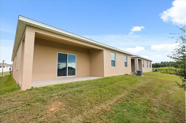 a house view with a backyard space