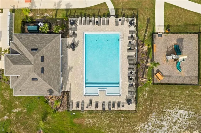 swimming pool view with a outdoor seating space