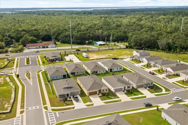 a view of a swimming pool with a yard
